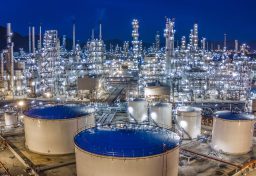 Aerial,View,Oil,Storage,Tank,With,Oil,Refinery,Background,,Oil